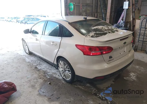 2015 Ford Focus Titanium z USA, uszkodzony, nr VIN 1FADP3J22FL248021